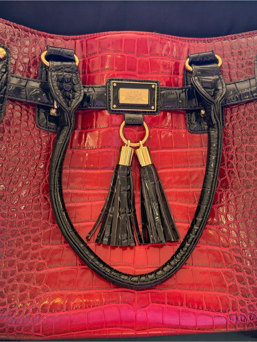Red Croc-Embossed rolling Tote with Black Trim and Tassel Detail